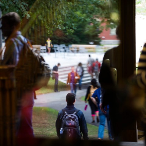 Harvard University students on their way about campus in Cambridge, Mass. (Photo by Gretchen Ertl/The New York Times/Redux)