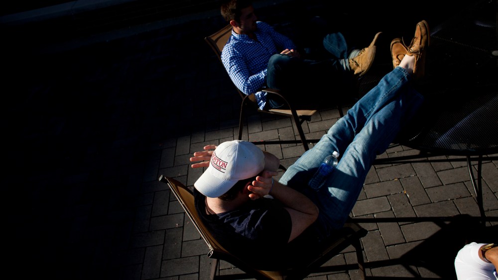 Students sit in the fraternity quad at Northwestern University in Evanston, Ill.