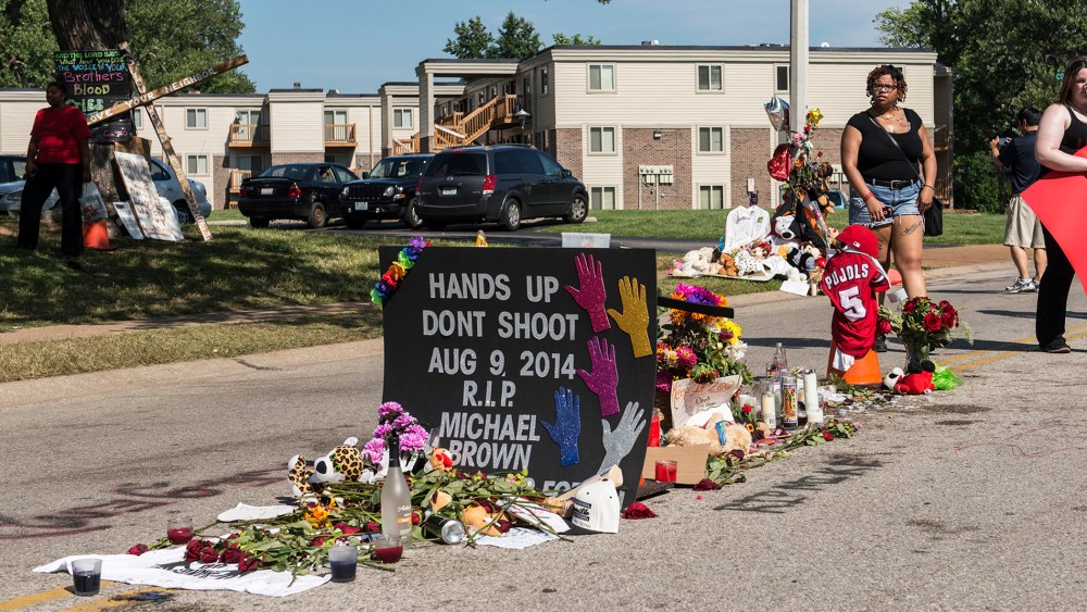 A small memorial marks the place where Michael Brown's body fell after being killed by a police officer in Ferguson, Mo.