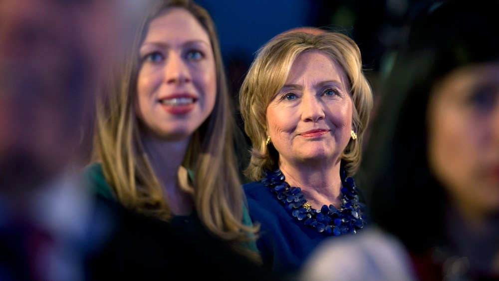 Former Secretary of State Hillary Rodham Clinton sits in the audience at a meeting during the Clinton Global Initiative in New York, Sept. 23, 2014. (Photo by Stephen Crowley/The New York Times/Redux)
