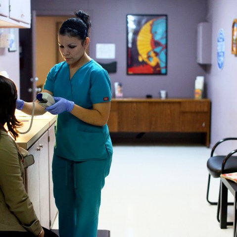 Nyla Munoz, a medical assistant, helps a patient through a pre-op appointment during the final day of seeing patients at Whole Women's Health Clinic, an abortion clinic, in McAllen, Texas.