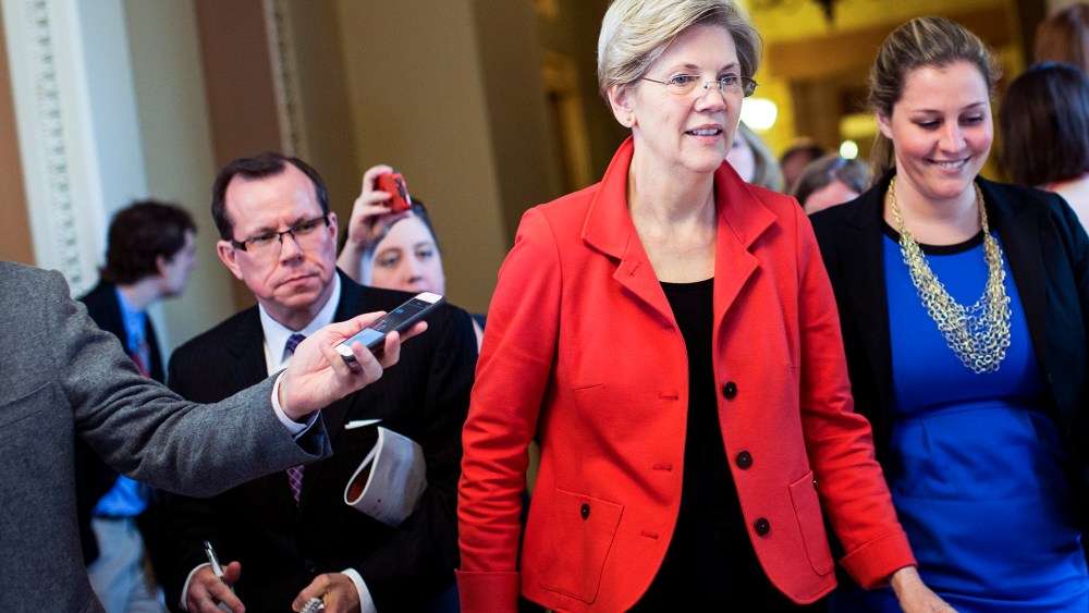 Sen. Elizabeth Warren (D-Mass.) exits a Democratic caucus meeting on Capitol Hill in Washington, Nov. 13, 2014. (Photo by Drew Angerer/The New York Times/Redux)