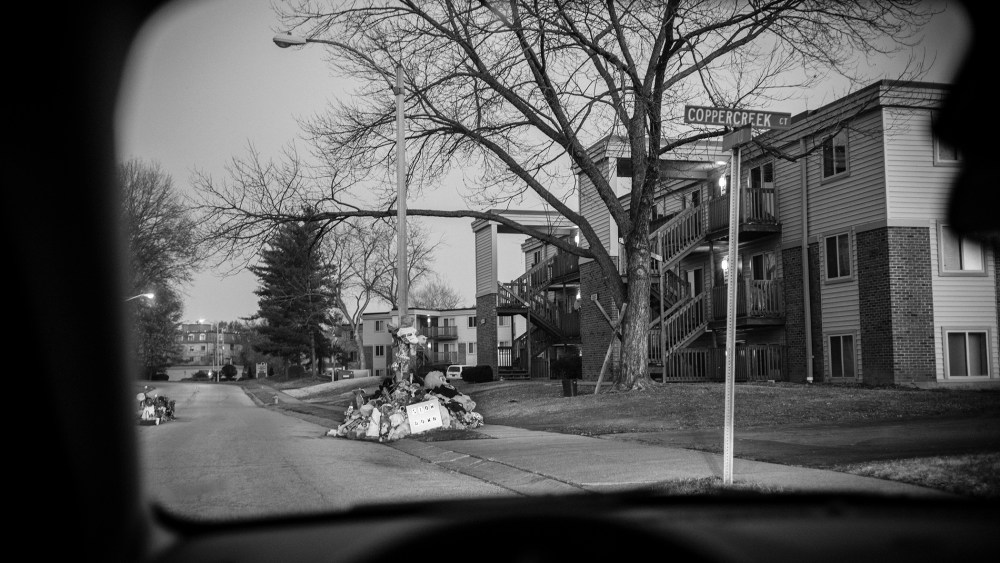 A view through a car window of the street in front of the Canfield apartment complex where teenager Michael Brown was shot and killed is seen on Nov. 28, 2014 in Ferguson, Mo. (Photo by David Butow/Redux)