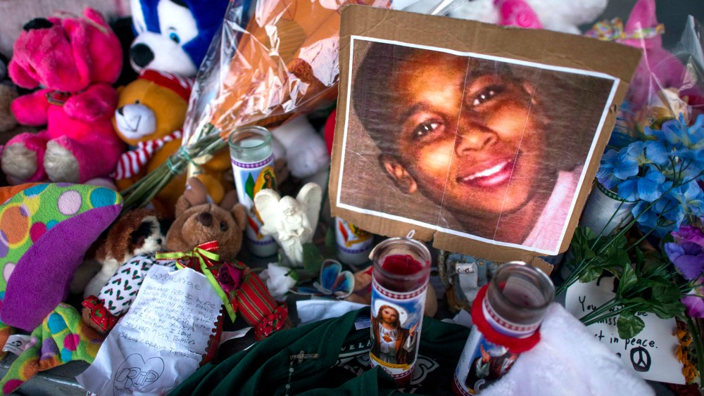 A makeshift memorial on a picnic table for Tamir Rice, the 12-year-old boy carrying a pellet gun who was fatally shot by a Cleveland police officer, in Cleveland, Dec. 4, 2014. (Photo by Ty Wright/The New York Times/Redux)