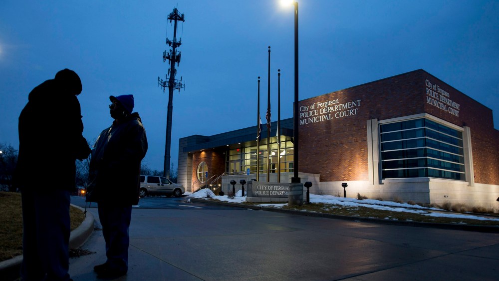 Protesters stand outside the Ferguson Police Department in Ferguson, Mo., March 3, 2015. (Photo by Whitney Curtis/The New York Times/Redux)