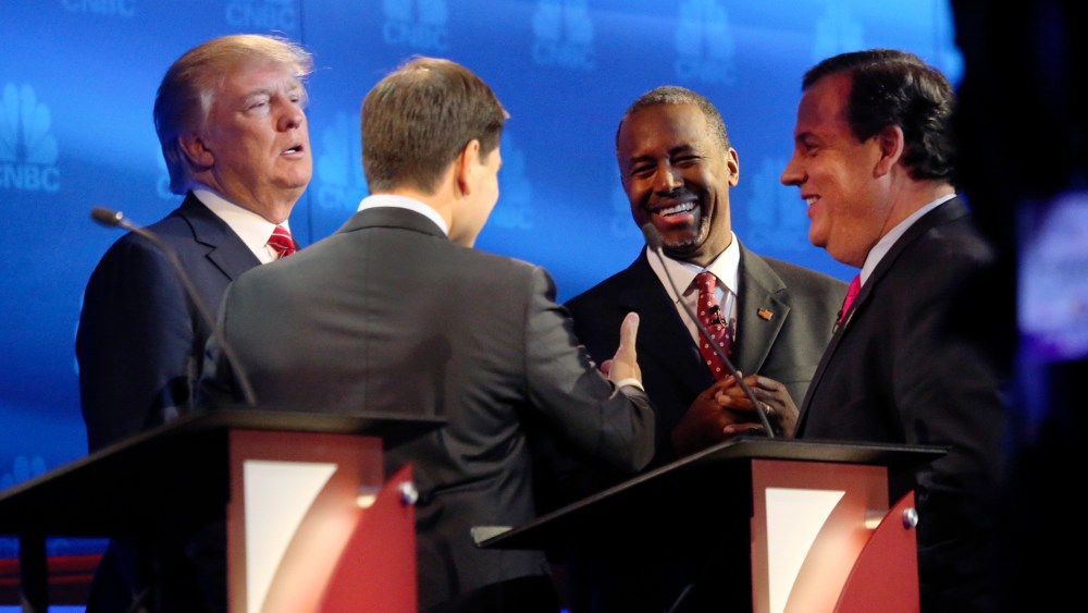 Donald Trump, Sen. Marco Rubio, Ben Carson and Gov. Chris Christie gather to talk during a break in the debate of Republican presidential hopefuls at the University of Colorado in Boulder, Oct. 28, 2015. (Photo by Jim Wilson/The New York Times/Redux)