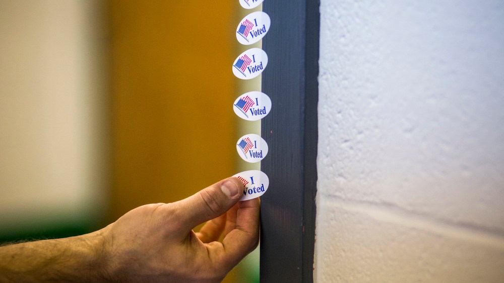 A voter takes an "I Voted" sticker after casting their ballot at the Shelby Park Community Center, a polling station in Nashville, Tenn., March 1, 2016. (Photo by Joe Buglewicz/The New York Times/Redux)