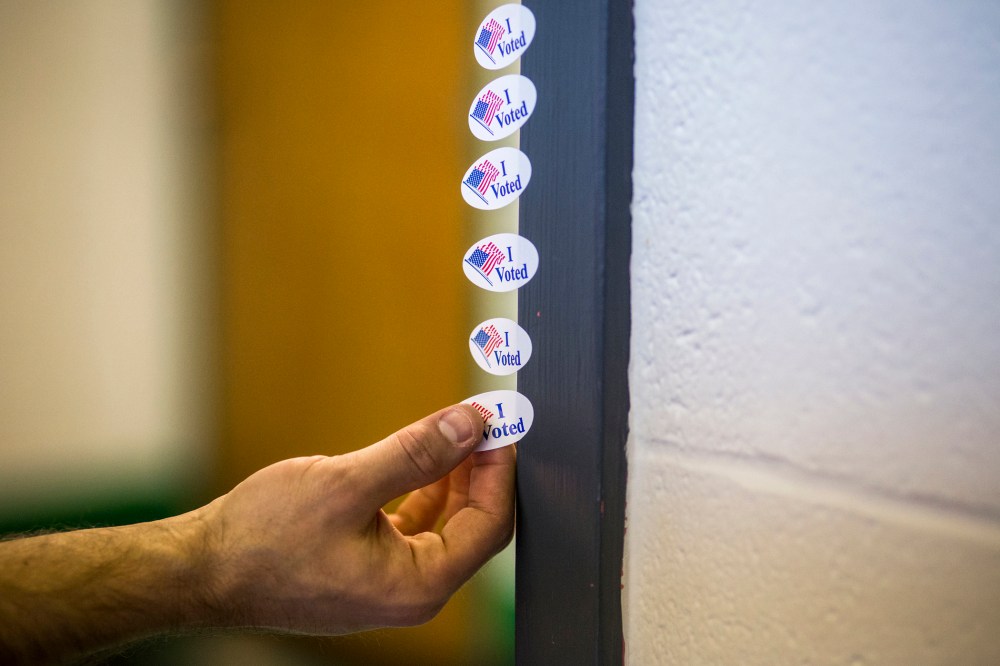 A voter takes an "I Voted" sticker after casting their ballot at the Shelby Park Community Center, a polling station in Nashville, Tenn., March 1, 2016. (Photo by Joe Buglewicz/The New York Times/Redux)