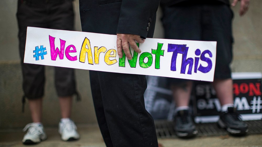An opponent of a new state law that restricts transgender bathroom use and pre-empts local governments from creating their own related policies with a sign at a rally (Photo by Ray Whitehouse/The New York Times/Redux)