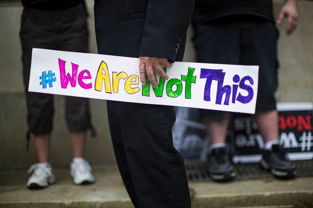 An opponent of a new state law that restricts transgender bathroom use and pre-empts local governments from creating their own related policies with a sign at a rally (Photo by Ray Whitehouse/The New York Times/Redux)
