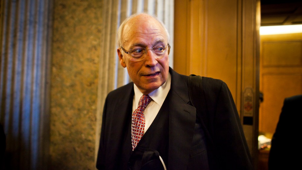 Former Vice President Dick Cheney walks out of a Republican Senate luncheon, Nov. 2011.
