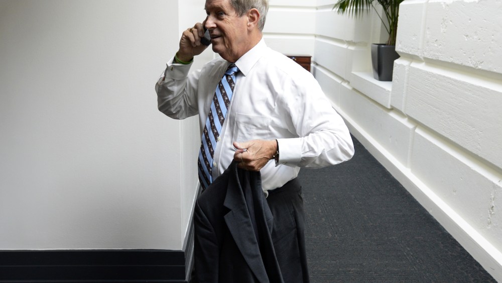Republican Representative from South Carolina, Joe Wilson speaks on a cell phone while walking to a meeting of House Republicans on the fourth day of a partial federal government shutdown, on Capitol Hill in Washington DC, USA, 04 October 2013.