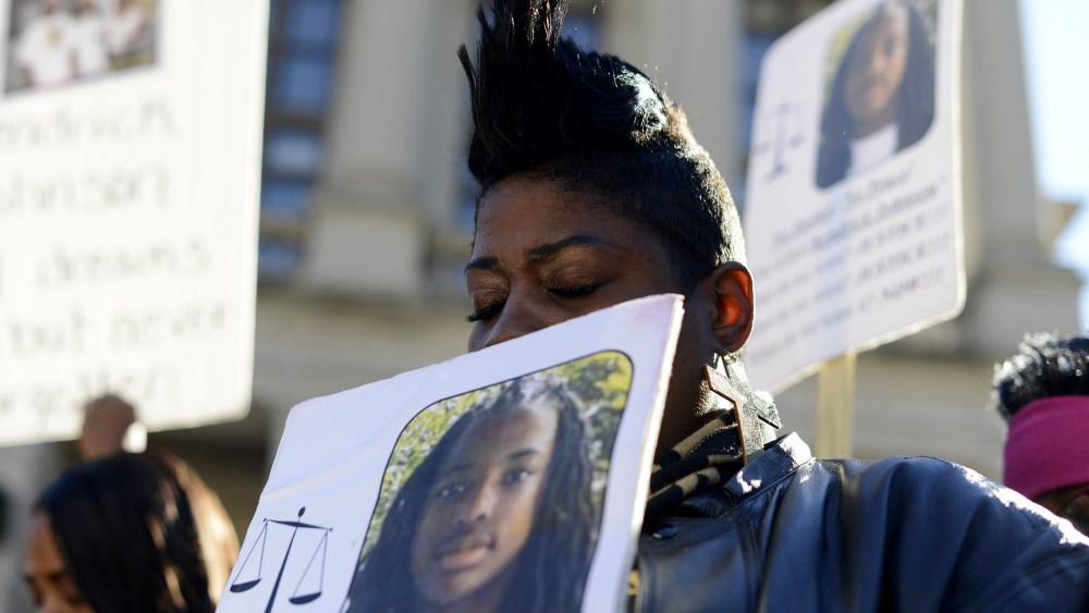 Tesha Tooley, an aunt Georgia teen Kendrick Johnson who was found dead in a gym mat at Lowndes County High School in Valdosta, Ga. , participates in a rally on his behalf at the Georgia State Capitol in Atlanta, Ga., Dec. 11, 2013.