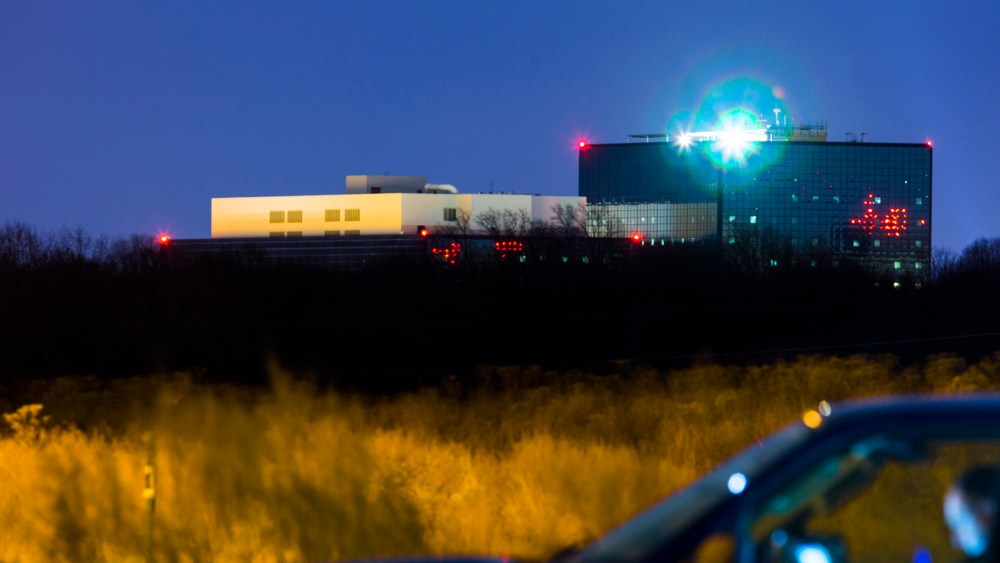 A Maryland State Trooper sits in an unmarked SUV outside the grounds of the National Security Agency (NSA) in Fort Meade, Md. on Dec. 22, 2013.