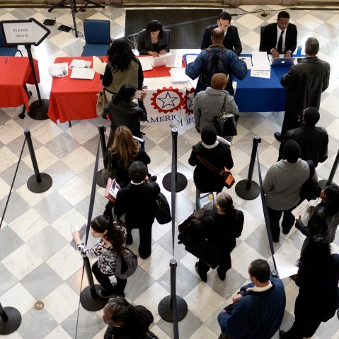 Job seekers wait to speak with employers at a job fair in the Brooklyn borough of New York, N.Y., on April 11, 2014. (Photo by Andrew Gombert/EPA)