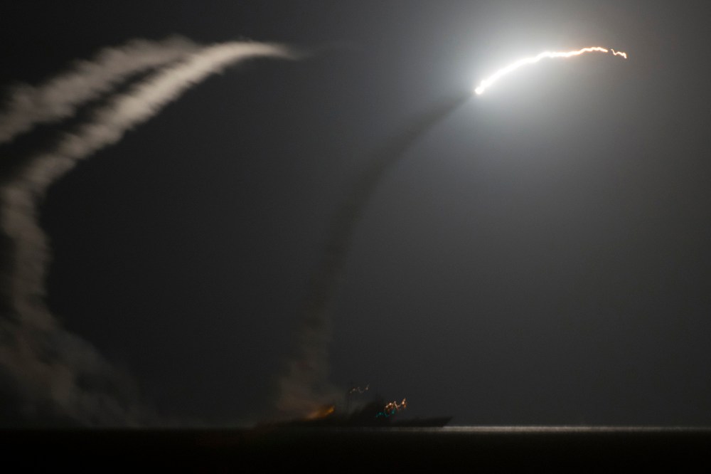 A handout picture released by the US Navy shows the guided-missile cruiser USS Philippine Sea (CG 58) launching a Tomahawk cruise missile against IS (Islamic State) targets in Syria, as seen from the aircraft carrier USS George H.W. Bush (CVN 77) in the A