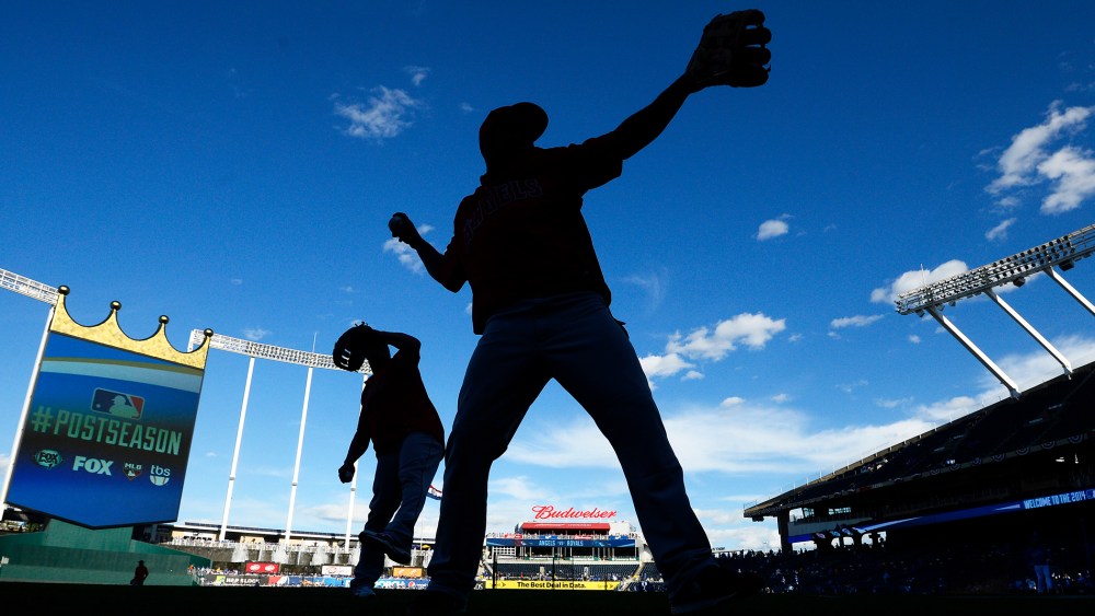 Los Angeles Angels players warm up before a game in Kansas City, Mo. on Oct. 5, 2014. (Photo by Larry W. Smith/EPA)