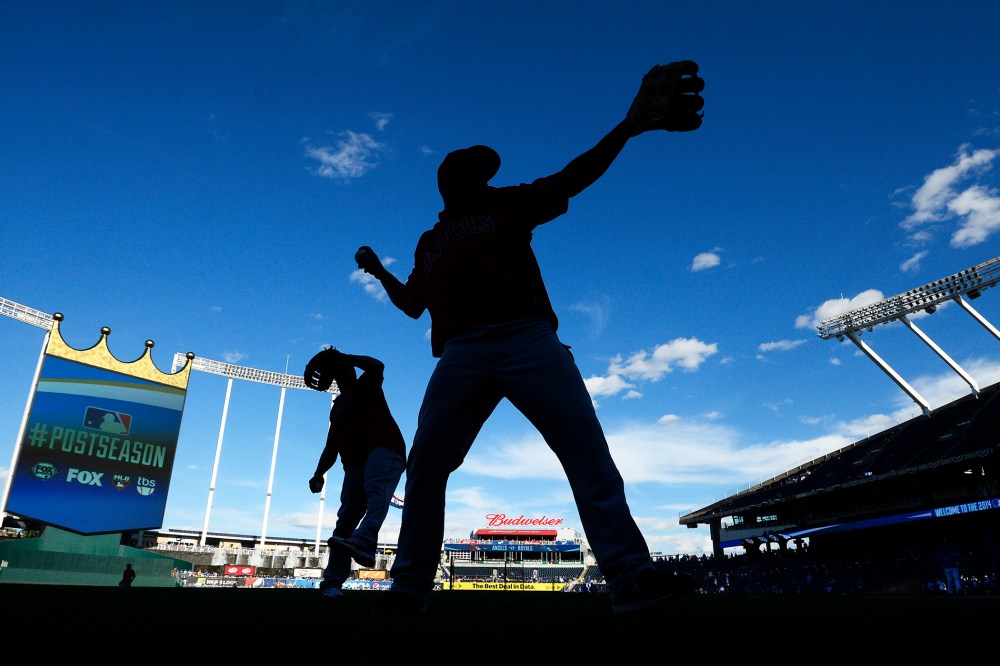 Los Angeles Angels players warm up before a game in Kansas City, Mo. on Oct. 5, 2014. (Photo by Larry W. Smith/EPA)