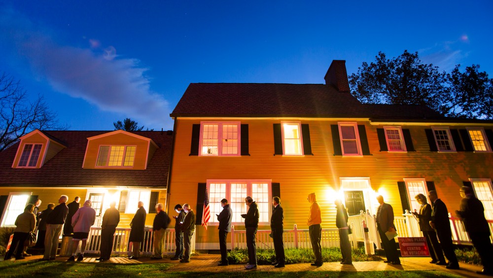 Virginia residents wait in line in the pre-dawn hours to vote in the 2014 US midterm elections at a historic property called the Hunter House at Nottoway Park in Vienna, Va, on Nov. 4, 2014. (Photo by Jim Lo Scalzo/EPA)
