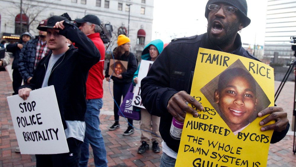Protesters march during a rally at Public Square in Cleveland, Ohio on Nov. 24, 2014, following the November 22 fatal shooting of 12 year old Tamir Rice by a Cleveland Police officer. (Photo by David Maxwell/EPA)