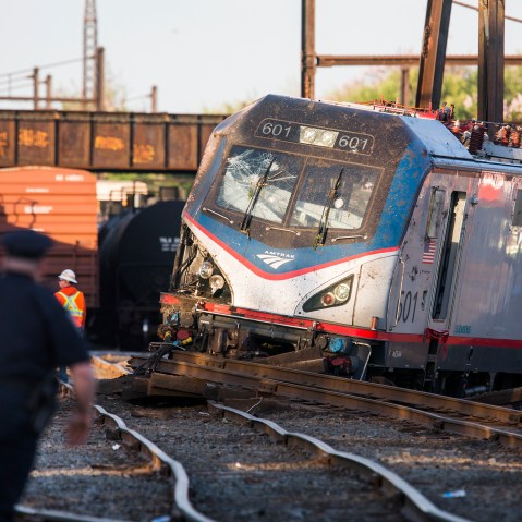 The remains of an Amtrak train that derailed on its way from Washington, DC to New York City are seen just outside Philadelphia, Pa. on May 13, 2015. (Photo by Jim lo Scalzo/EPA)