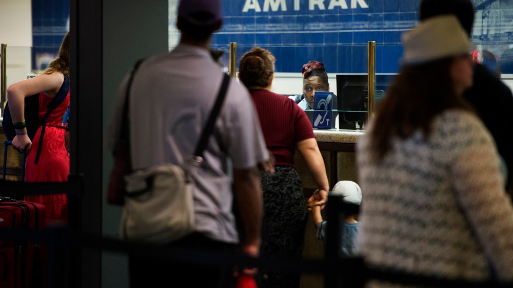 Travelers stand in line for tickets and information at the Amtrak desk at Union Station in Washington, DC on May 13, 2015. (Photo by Shawn Thew/EPA)