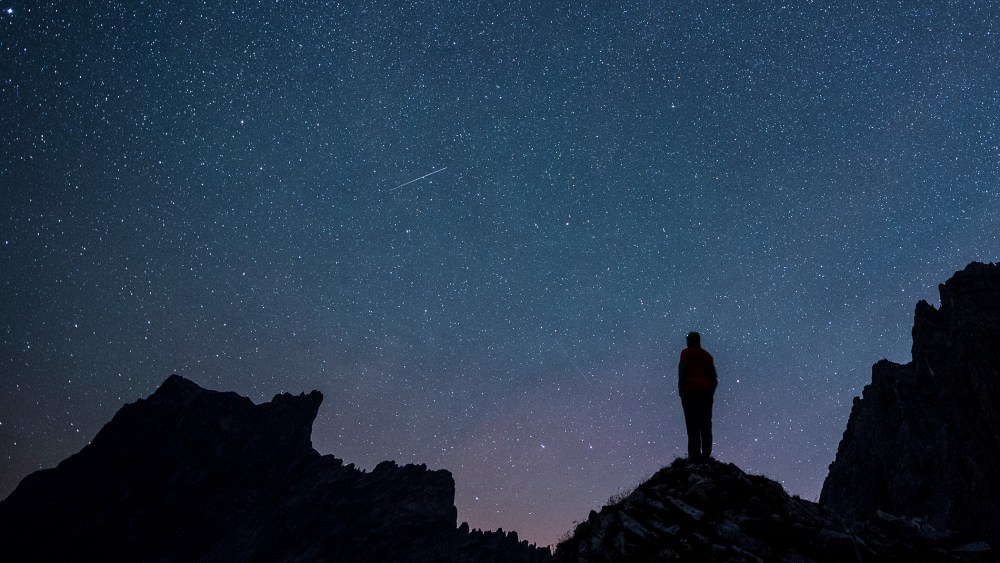 Stars and shooting stars are pictured during the annual Perseids meteor shower, with the 2827-meters Drusenfluh mountain (L) and the 2817-meters Sulzfluh mountain (R), in St. Antoenien in the canton of Grisons, Switzerland, on Aug. 13, 2015.