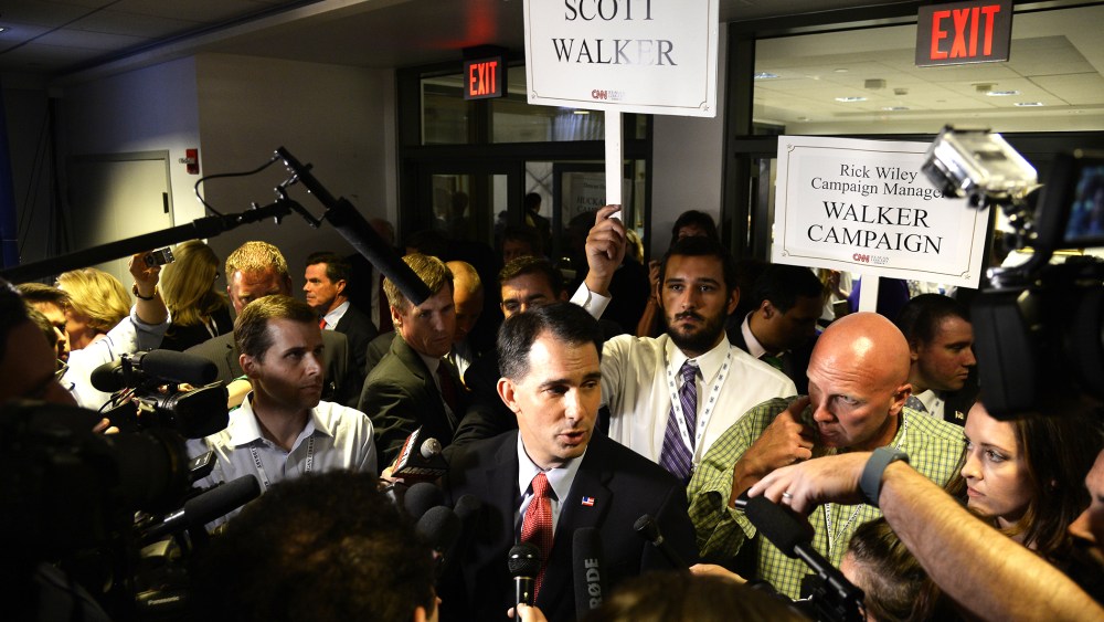 Republican presidential candidate Scott Walker meets the media in the Spin Room following the second GOP Presidential candidates debate at the Ronald Reagan Presidential Library in Simi Valley, Calif., Sept. 16, 2015. (Photo by Mike Nelson/EPA)