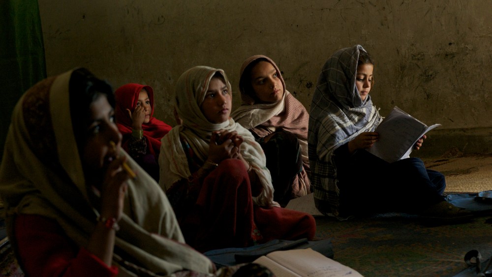A group of conflict displaced Bajauri girls sit in a class in a UNICEF supported school in Risalpur, Pakistan in 2011.