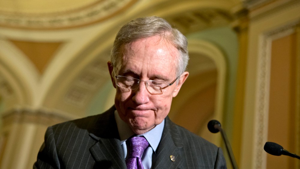 Senate Majority Leader Harry Reid of Nev. pauses as he meet with reporters  on Capitol in Washington, Tuesday, Nov. 27, 2012, following a Democratic strategy session.  (AP Photo/J. Scott Applewhite)