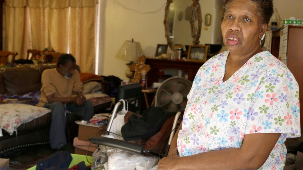 Part-time home health care provider Debra Walker in her home in Houston. She had a good job with health insurance until she got laid off in 2007.  (Photo by Pat Sullivan/AP Photo)