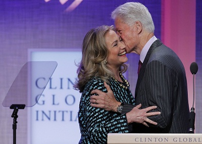 Bill Clinton kisses his wife, Secretary of State Hillary Clinton, as he introduces her at the Clinton Global Initiative in New York on September 24, 2012. (Photo by Lucas Jackson/Reuters/File)
