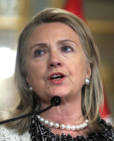 Image: U.S. Secretary of State Hillary Clinton gives a speech to the media at the government palace in Lima