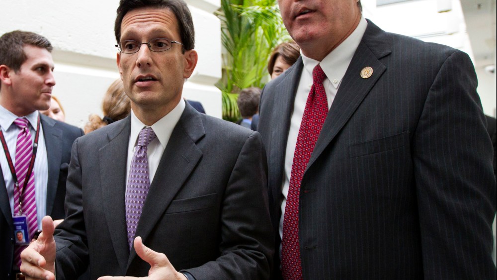 File Photo: House Majority Leader Eric Cantor, R-Va., left, confers with Rep. Trent Franks, R-Ariz., right, following a weekly House GOP strategy session, at the Capitol, Tuesday, May 8, 2012.  (Photo by J. Scott Applewhite/ AP Photo)