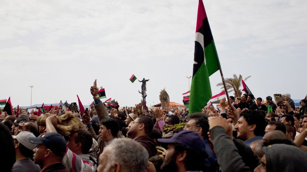 Libyans celebrate in the main square. The U.N. Security Council voted Thursday to impose a no-fly zone over Libya to protect civilians from attacks by Moammar Gadhafi's forces, hours after the Libyan leader vowed to crush the rebellion.
