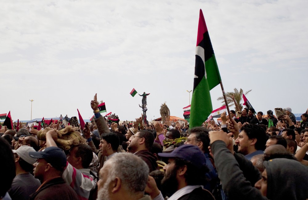 Libyans celebrate in the main square. The U.N. Security Council voted Thursday to impose a no-fly zone over Libya to protect civilians from attacks by Moammar Gadhafi's forces, hours after the Libyan leader vowed to crush the rebellion.