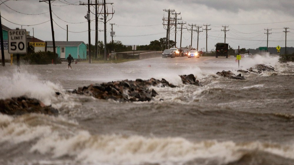 Strong winds and heavy surf cover Hwy 64 at the Albemarle Sound caused by Hurricane Arthur on July 3, 2014 in Nags Head, North Carolina.