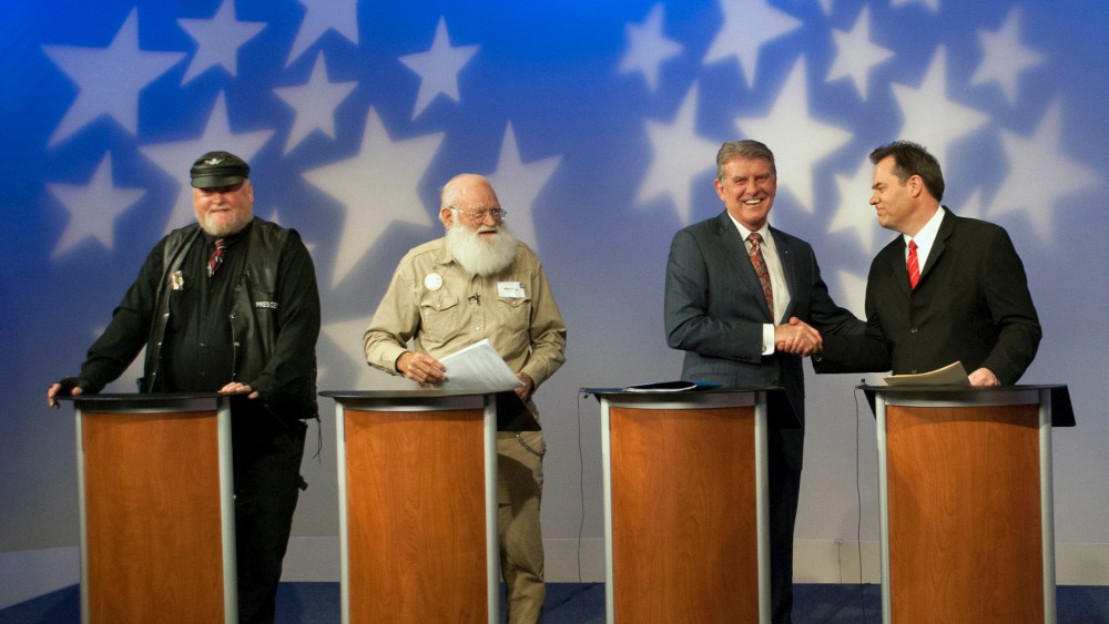 In this image provided by Idaho Public Television, Idaho Gov. Butch Otter, second right, appears on stage with Republican gubernatorial hopefuls, from left, Harley Brown, Walt Bayes, and state Sen. Russ Fulcher, at a debate Thursday May 15, 2014.