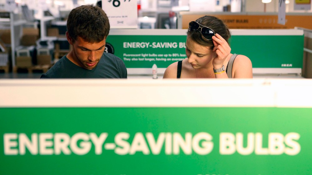 Joe Mozloom and Allison Roethke shop for compact fluorescent bulbs at an Ikea store in Philadelphia, Tuesday, June 15, 2010.