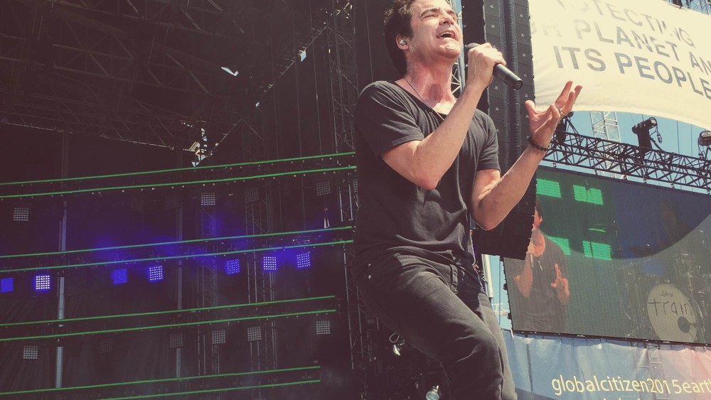 Lead singer Patrick Monahan performs with his band Train (not pictured) at the Global Poverty Project's Global Citizen 2015 Earth Day at the National Mall in Washington, DC, April 18, 2015. (Photo by Jared Soares/MSNBC)