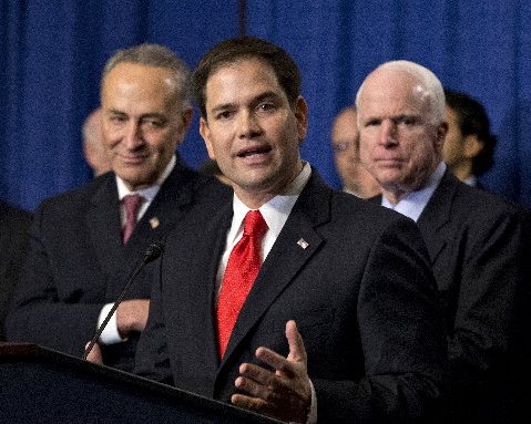 Sen. Marco Rubio, R-Fla., flanked by Sen. Charles Schumer, D-N.Y., left, and Sen. John McCain, R-Ariz., right, speaks about immigration reform legislation as outlined by the Senate's bipartisan "Gang of Eight" April 18, 2013, on Capitol Hill in...