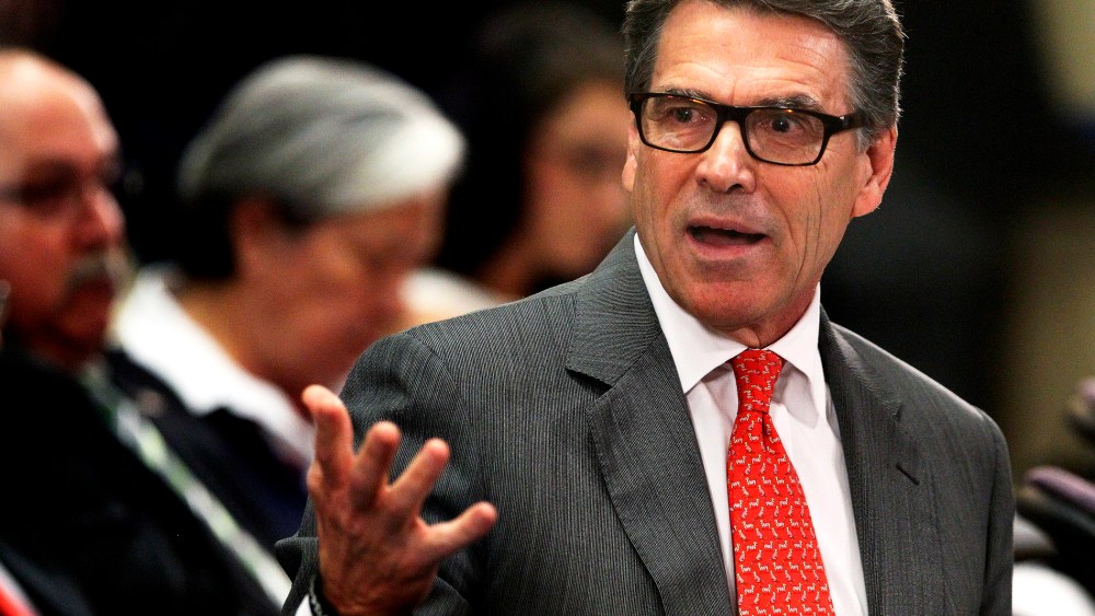 Texas Gov. Rick Perry talks to members of the U.S. House Committee on Homeland Security about the humanitarian and national security crises going on along the Texas-Mexico border, July 3, 2014 in McAllen, Texas.