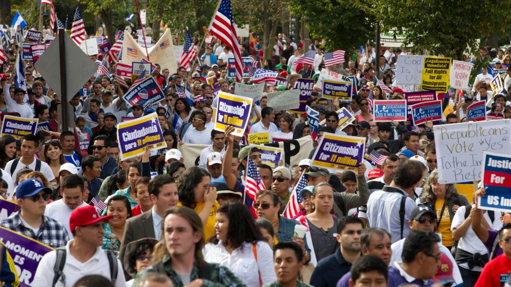 Demonstrators march towards Capitol Hill during a immigration rally and march in Washington, D.C., Tuesday, Oct. 8, 2013.