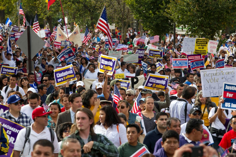 Demonstrators march towards Capitol Hill during a immigration rally and march in Washington, D.C., Tuesday, Oct. 8, 2013.