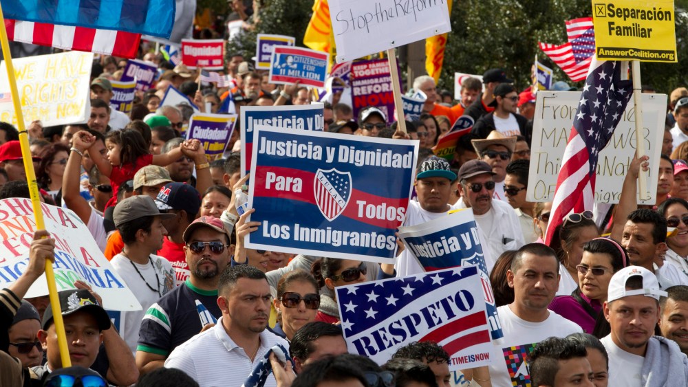 Demonstrators march towards Capitol Hill during a immigration march and rally in Washington, D.C. October 8, 2013.