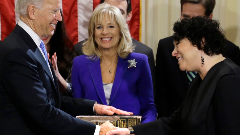 Vice President Joe Biden, with his wife Jill Biden, center, holding the Biden Family Bible, shakes hands with Supreme Court Justice Sonia Sotomayor after taking the oath of office during an official ceremony at the Naval Observatory, Sunday, Jan. 20,...