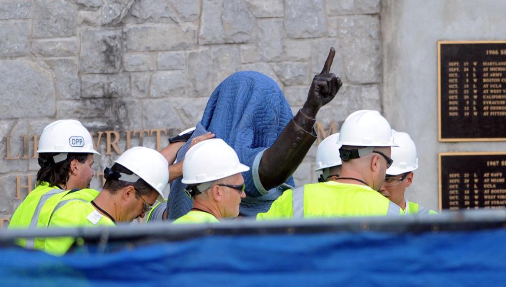 The statue of the late Joe Paterno at Penn State's Beaver Stadium was removed early yesterday. Today, crippling NCAA sanctions were levied upon the football program.