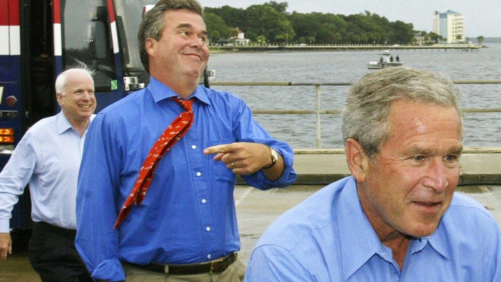 US President George W. Bush, followed by