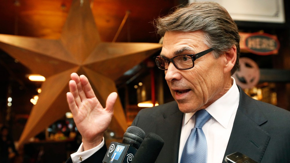 Texas Gov. Rick Perry speaks to the members of the media at a restaurant in New York, April 23, 2014.