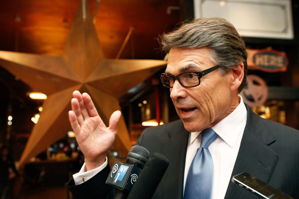 Texas Gov. Rick Perry speaks to the members of the media at a restaurant in New York, April 23, 2014.